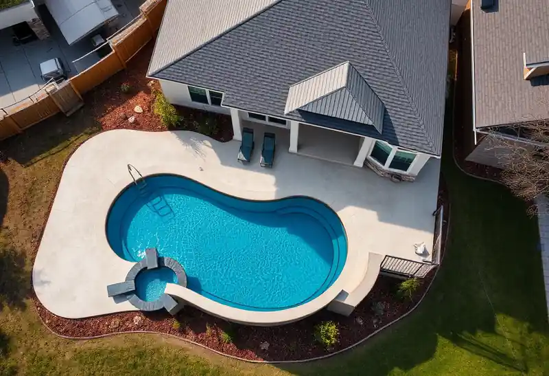 Illustration of new in-ground pool with a concrete deck in a 1995-era home